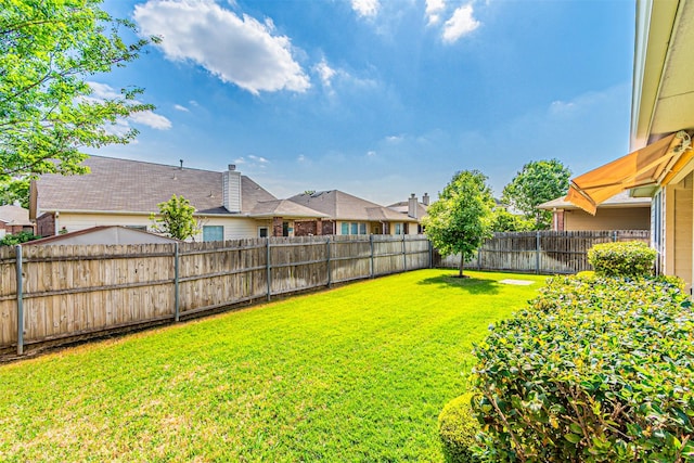 view of yard featuring a fenced backyard