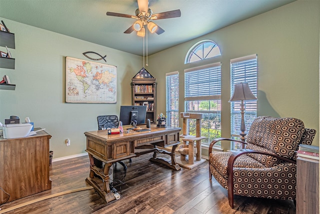 office featuring hardwood / wood-style floors, a ceiling fan, and baseboards