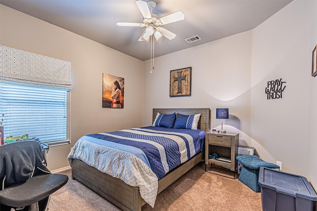 bedroom with visible vents, baseboards, a ceiling fan, and carpet flooring