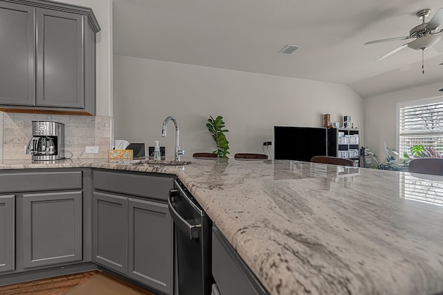 702 Grassland Way, Arlington, TX 76002 - kitchen featuring gray cabinets, stainless steel dishwasher, lofted ceiling, ceiling fan, and decorative backsplash