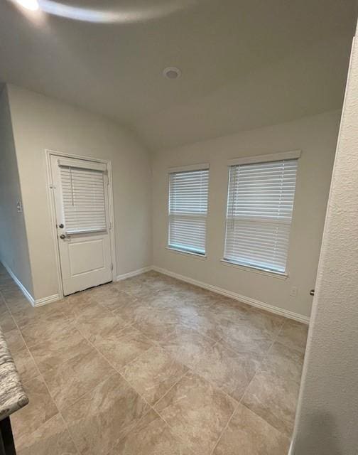 702 Grassland Way, Arlington, TX 76002 - empty room featuring vaulted ceiling and baseboards