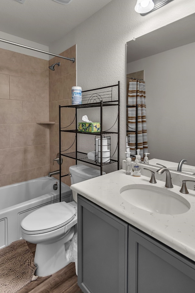 702 Grassland Way, Arlington, TX 76002 - bathroom with vanity, wood finished floors, and shower / tub combo