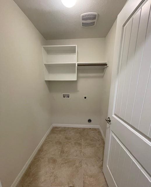 702 Grassland Way, Arlington, TX 76002 - washroom with electric dryer hookup, washer hookup, and a textured ceiling