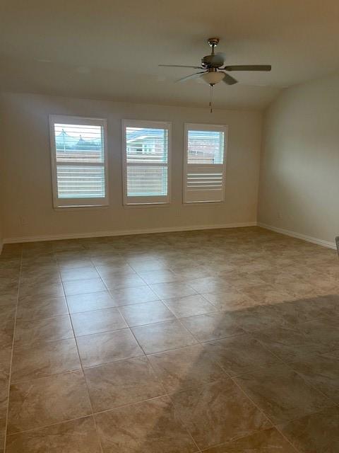 702 Grassland Way, Arlington, TX 76002 - tiled spare room featuring a ceiling fan and baseboards