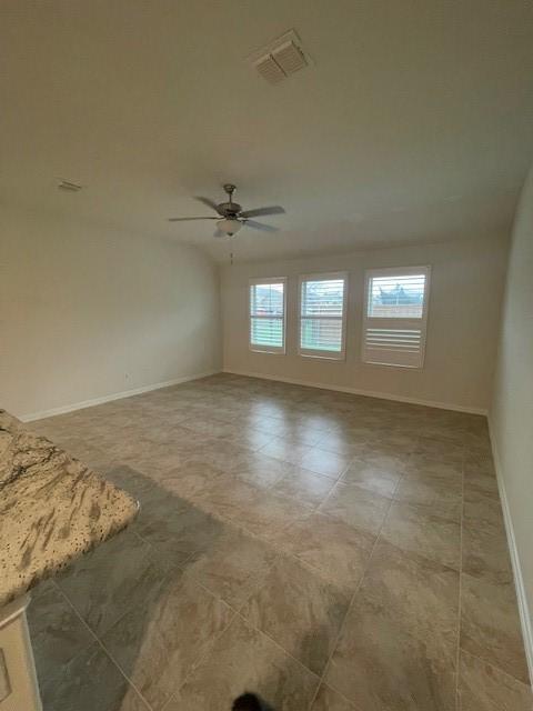702 Grassland Way, Arlington, TX 76002 - empty room with baseboards and a ceiling fan