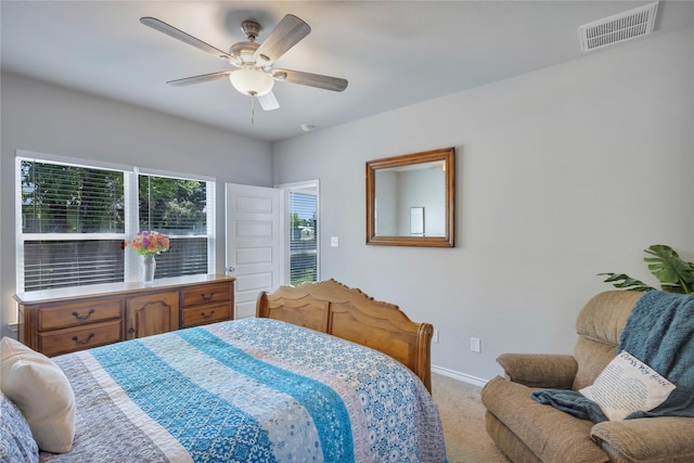 bedroom with ceiling fan, baseboards, carpet flooring, and visible vents