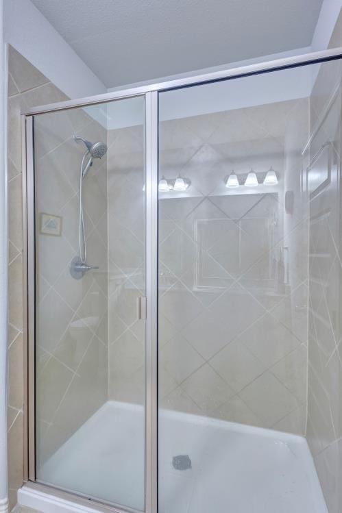 bathroom with a shower stall