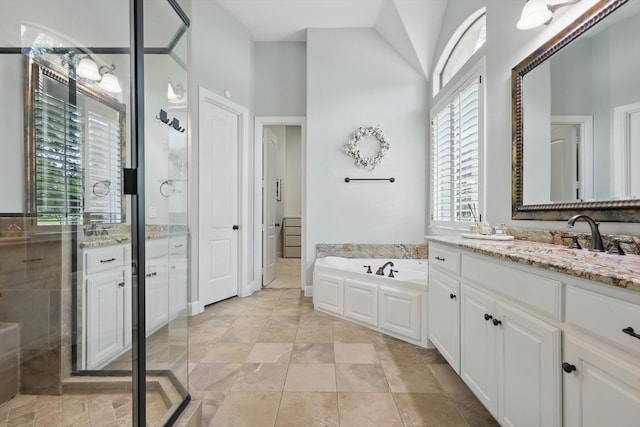 full bathroom featuring high vaulted ceiling, a bath, a shower stall, and vanity