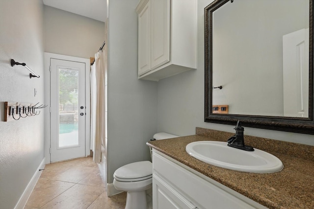 2204 Chipping Campden Rd, Denton, TX 76226 - bathroom featuring vanity, toilet, baseboards, curtained shower, and tile patterned floors