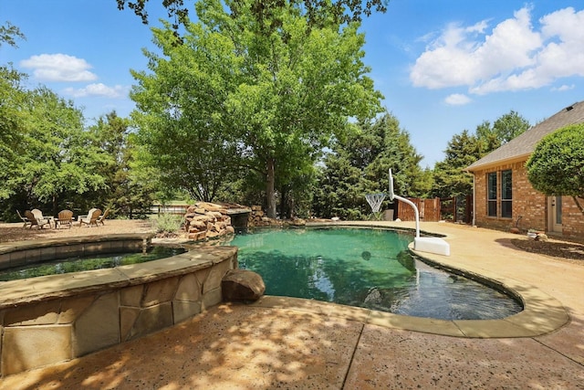 2204 Chipping Campden Rd, Denton, TX 76226 - view of swimming pool featuring a patio and a pool with connected hot tub