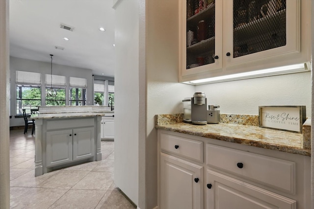 bar featuring recessed lighting, visible vents, and light tile patterned floors