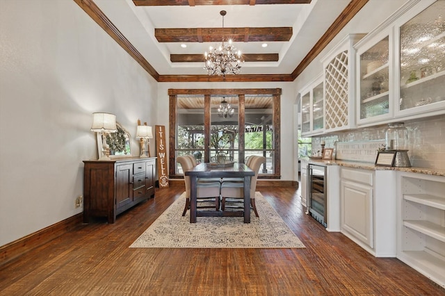 2204 Chipping Campden Rd, Denton, TX 76226 - dining room featuring a chandelier, wine cooler, a bar, dark wood-style flooring, and baseboards