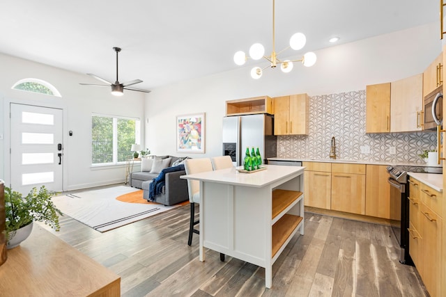 1823 S Ervay St, Dallas, TX 75215 - kitchen featuring stainless steel appliances, light brown cabinetry, a sink, open shelves, and decorative backsplash