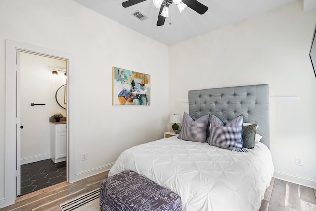 1823 S Ervay St, Dallas, TX 75215 - bedroom with wood finished floors, baseboards, and a ceiling fan