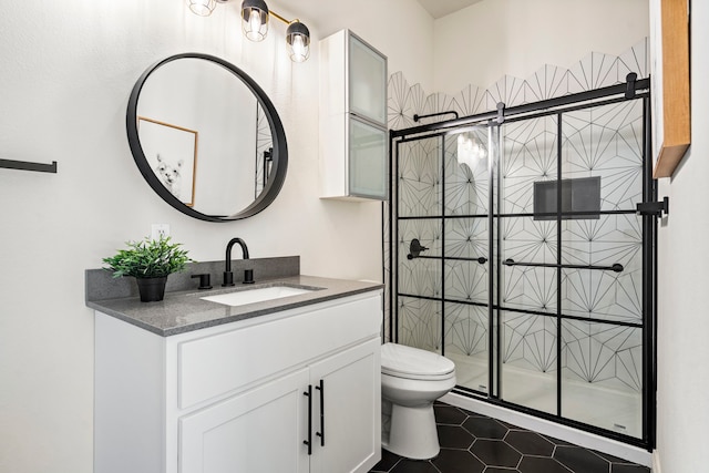 1823 S Ervay St, Dallas, TX 75215 - full bathroom with toilet, a shower stall, vanity, and tile patterned floors