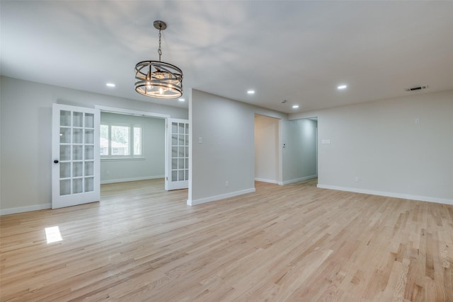 8494 Swift Ave, Dallas, TX 75228 - empty room with french doors, recessed lighting, a chandelier, light wood-type flooring, and baseboards