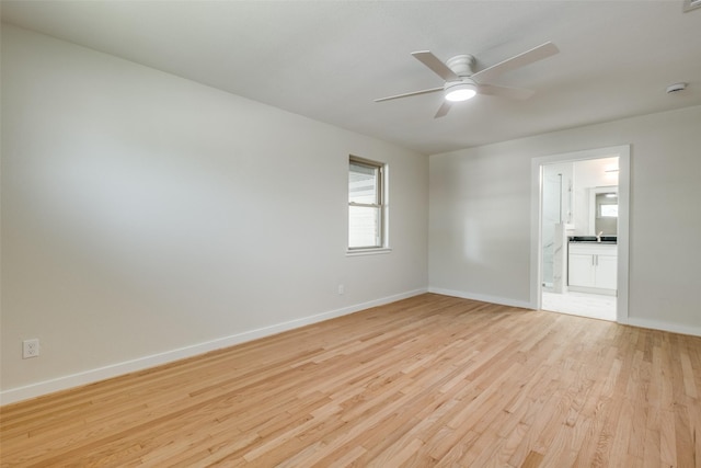 8494 Swift Ave, Dallas, TX 75228 - unfurnished room with light wood-type flooring, baseboards, and a ceiling fan