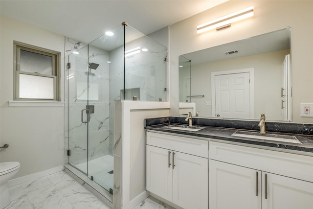 8494 Swift Ave, Dallas, TX 75228 - bathroom featuring marble finish floors, baseboards, toilet, a marble finish shower, and double vanity