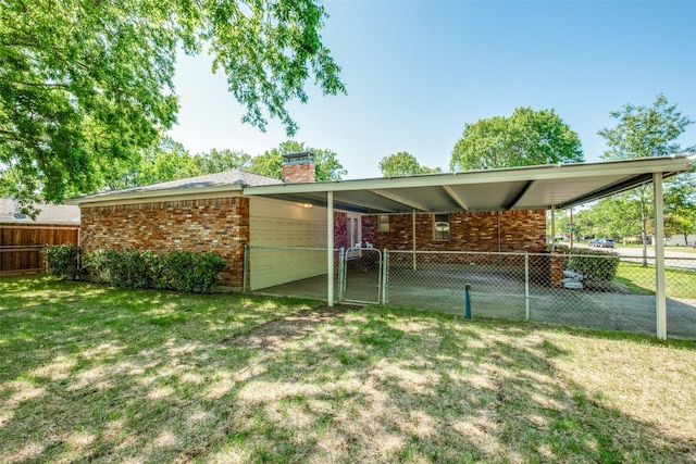 8494 Swift Ave, Dallas, TX 75228 - back of property with a chimney, brick siding, a gate, and a carport