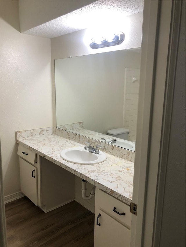 414 Brookview Dr, Desoto, TX 75115 - half bathroom with wood finished floors, toilet, and vanity