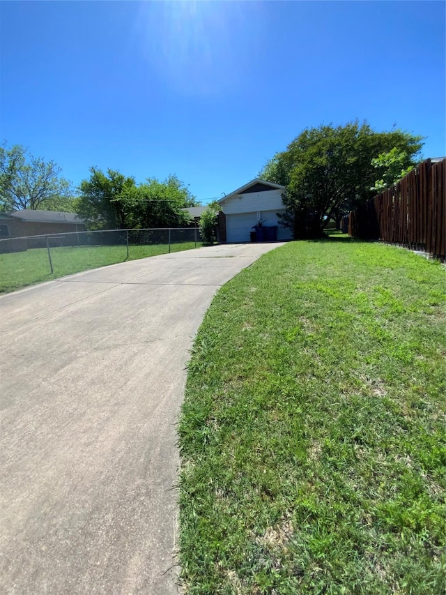 414 Brookview Dr, Desoto, TX 75115 - view of front of home with an attached garage, driveway, a front yard, and fence