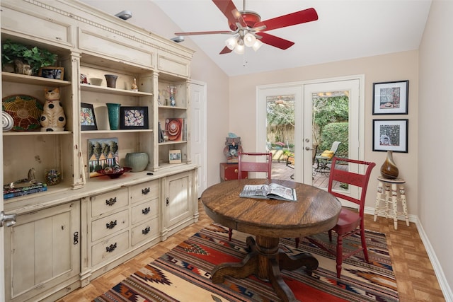 dining space featuring a ceiling fan, baseboards, and vaulted ceiling