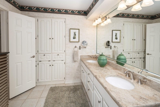 full bathroom with tile patterned floors, a sink, and double vanity