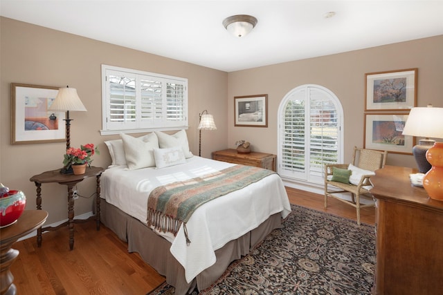 bedroom with wood finished floors
