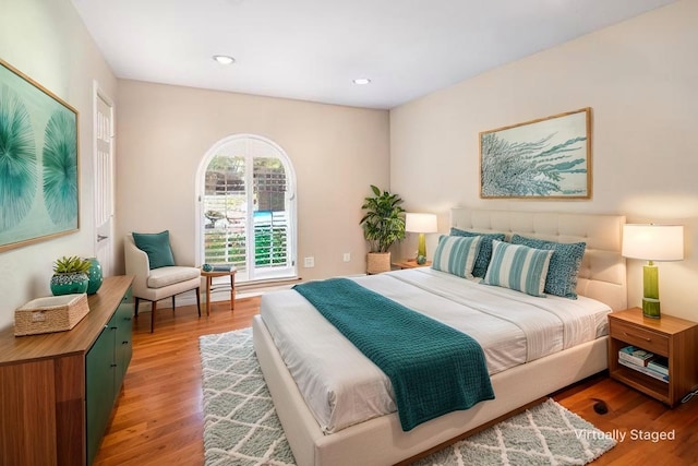 bedroom with recessed lighting and light wood-style floors
