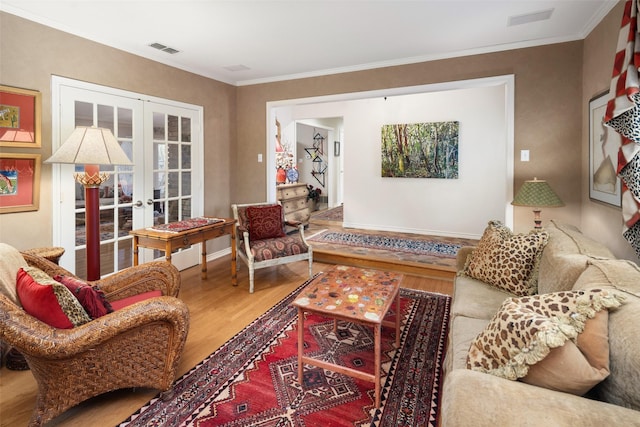 living room with french doors, wood finished floors, and visible vents
