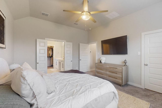bedroom featuring vaulted ceiling, light carpet, and visible vents