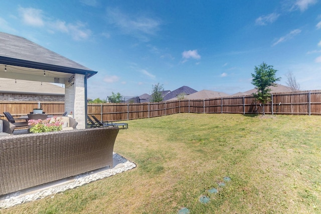 view of yard featuring an outdoor hangout area and a fenced backyard