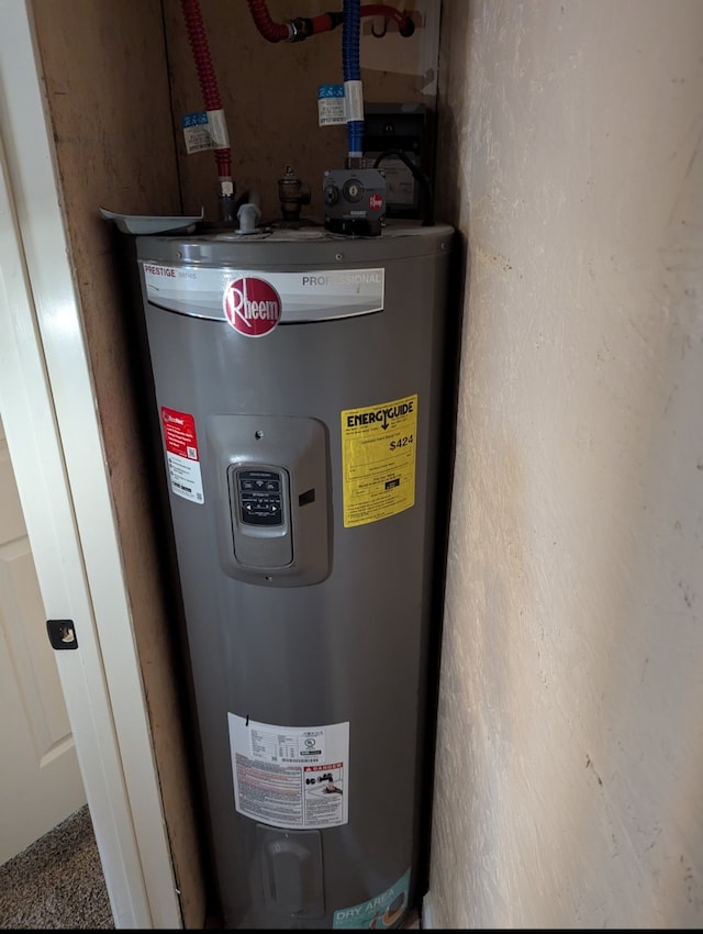 utility room featuring water heater