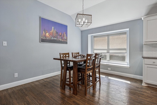 511 Ranchwood Dr, Justin, TX 76247 - dining room with vaulted ceiling, baseboards, dark wood-style flooring, and a chandelier