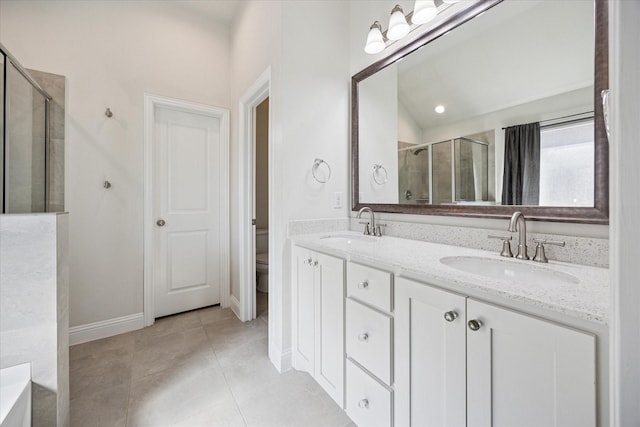 511 Ranchwood Dr, Justin, TX 76247 - full bath with tiled shower, double vanity, toilet, tile patterned floors, and baseboards