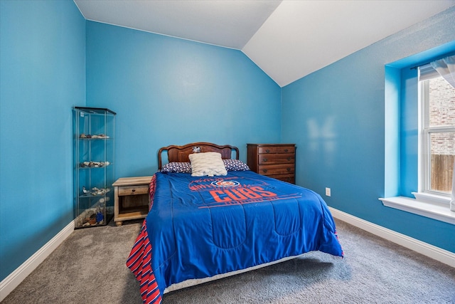 511 Ranchwood Dr, Justin, TX 76247 - carpeted bedroom with vaulted ceiling and baseboards
