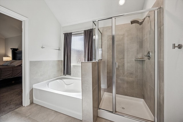 bathroom with a bath, ensuite bathroom, and a shower stall