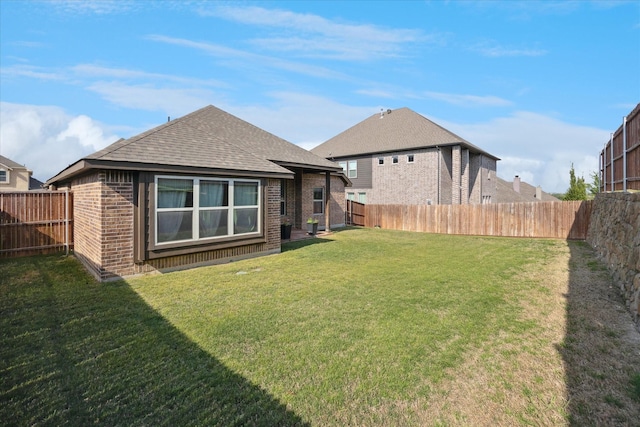 511 Ranchwood Dr, Justin, TX 76247 - back of property with brick siding and roof with shingles