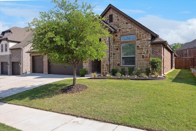 511 Ranchwood Dr, Justin, TX 76247 - view of front of house featuring concrete driveway, stone siding, an attached garage, and brick siding