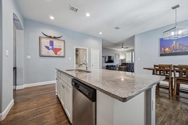 511 Ranchwood Dr, Justin, TX 76247 - kitchen with stainless steel dishwasher, a sink, dark wood-type flooring, white cabinetry, and recessed lighting
