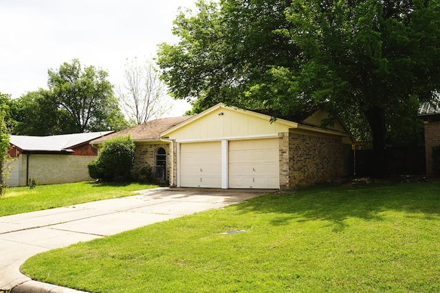 ranch-style house featuring concrete driveway, brick siding, a front yard, and a garage