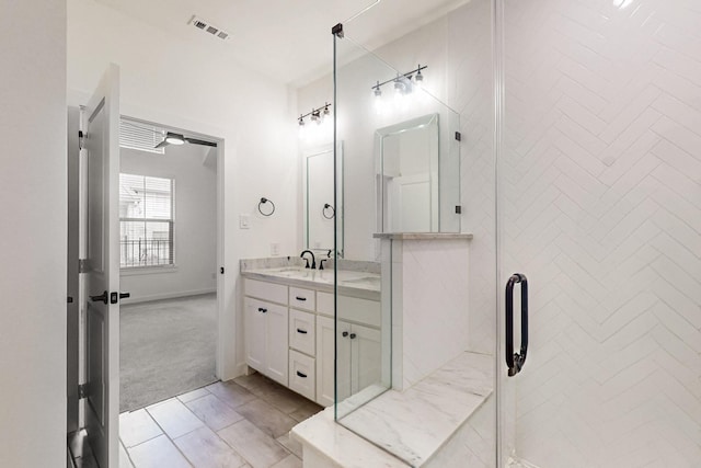 bathroom featuring a shower stall, visible vents, and vanity