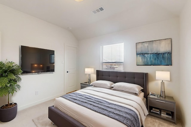 bedroom with carpet floors, vaulted ceiling, visible vents, and baseboards