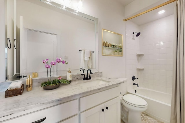 full bath with shower / bathing tub combination, vanity, and toilet