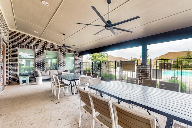 view of patio / terrace with fence, ceiling fan, outdoor dining space, and an outdoor living space