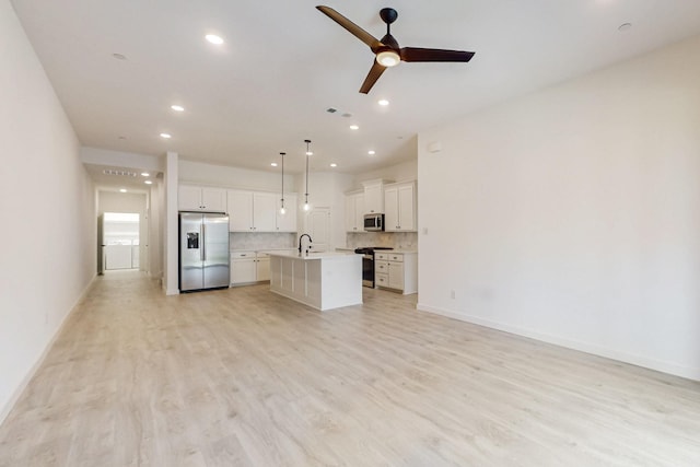 unfurnished living room with light wood-style flooring, visible vents, recessed lighting, and ceiling fan