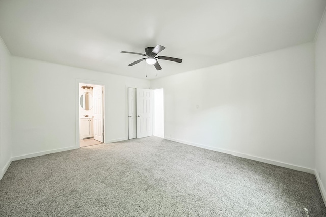 2126 Cedar St, Paris, TX 75460 - unfurnished bedroom with carpet, a ceiling fan, baseboards, and ensuite bathroom