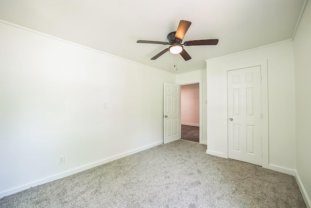 2126 Cedar St, Paris, TX 75460 - unfurnished bedroom featuring carpet, crown molding, baseboards, and ceiling fan