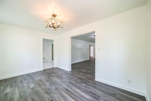 2126 Cedar St, Paris, TX 75460 - unfurnished room featuring dark wood-type flooring, baseboards, and a chandelier