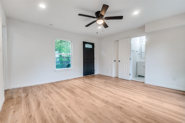 604 N E St, Arlington, TX 76011 - unfurnished bedroom featuring ensuite bath, baseboards, recessed lighting, and light wood-style floors